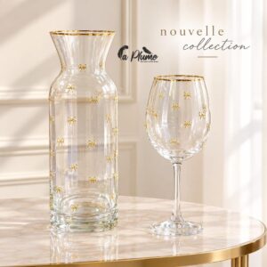Carafe et verre à pied en cristal aux motifs de nœuds dorés